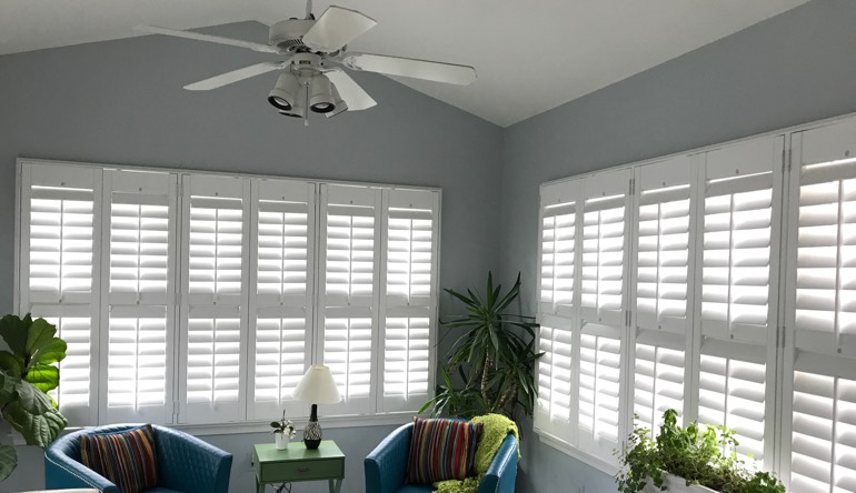 Sacramento living room with fan and shutters